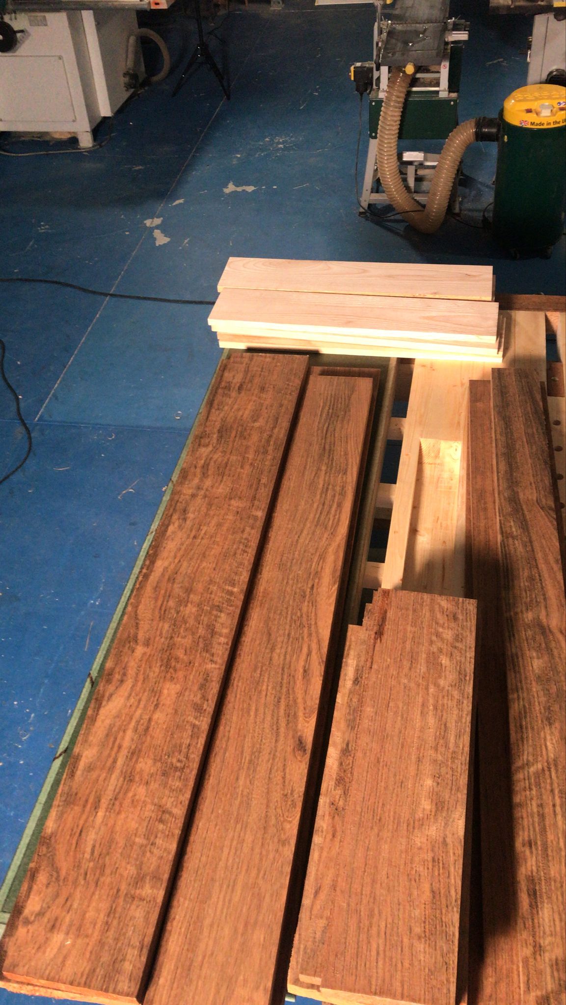 Charred oak boards, stacked and ready in the workshop